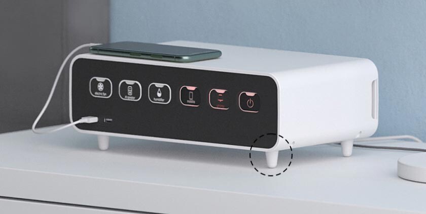A smartphone connecting to the built-in USB ports on the front of the Ablue Boxtap AB500 for convenient charging.