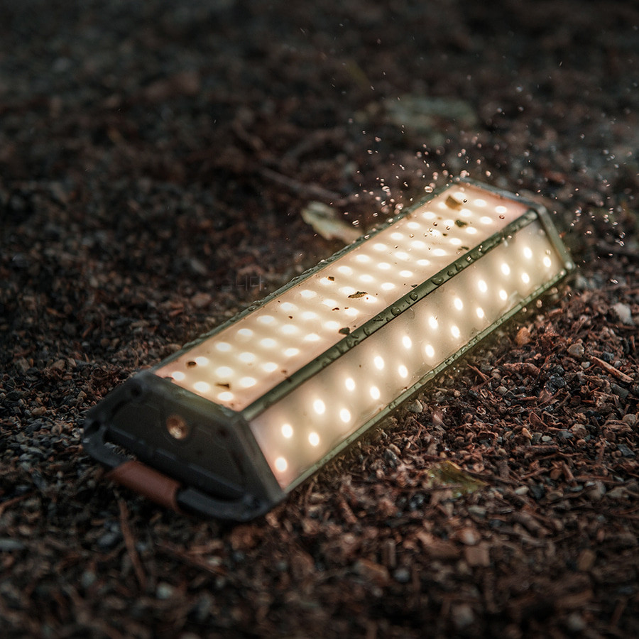 Claymore 3Face Neo30 Review highlighting the rugged LED camping lantern on rough sand