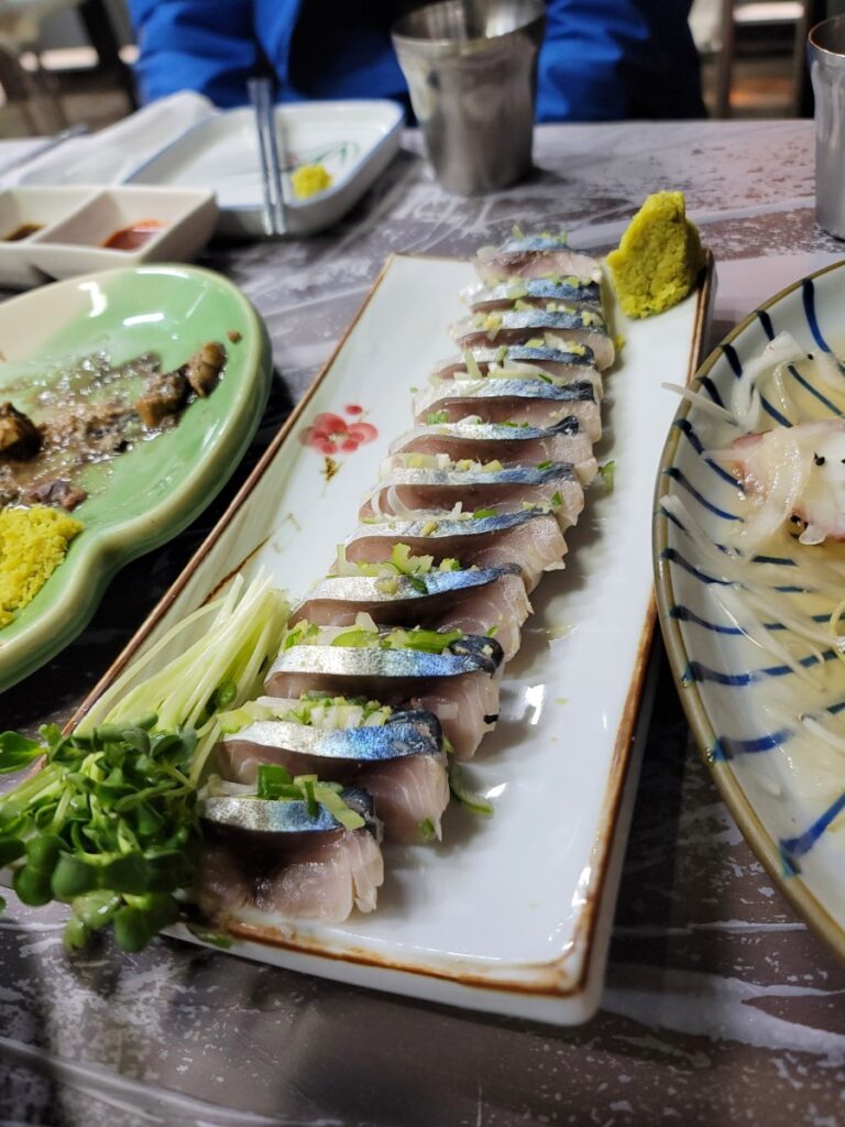 Slices of exceptionally fresh Korean raw mackerel sashimi, or Godeangeo-hoe, served immediately after preparation.