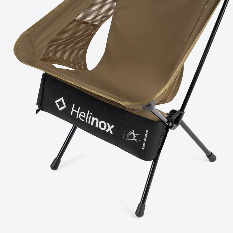 The carry bag attached to the headrest of the Helinox Sunset Chair re to be used as a pillow.