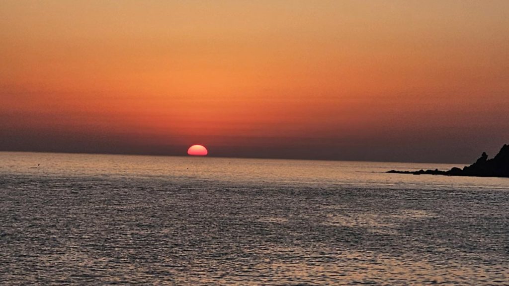 Sun beginning to rise over an island on Korea's west coast