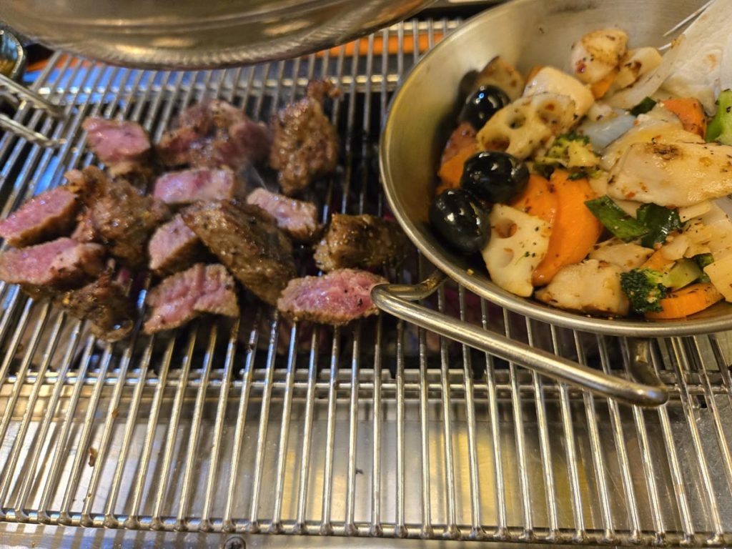 Korean charcoal-grilled beef served as a classic anju with drinks.