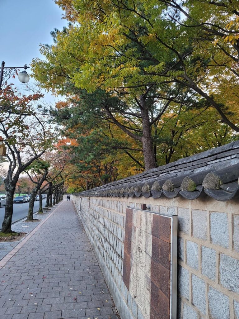 Beautiful path along a traditional Korean stone wall showing scenic cultural heritage.