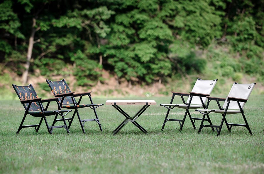 Minimal Works Life Folding Chair B Plus Review featuring multiple color options at a campsite