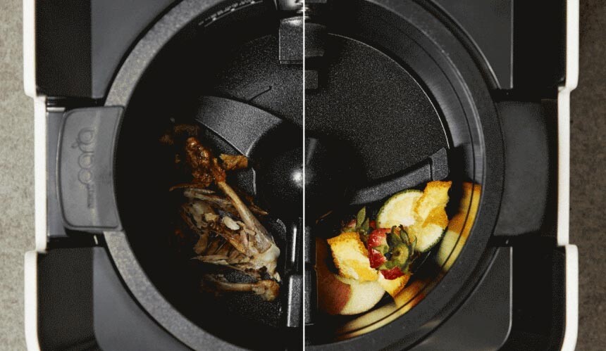A close-up shot of a person putting various kitchen food scraps into the open basket of the Smartcara 400 Pro X.