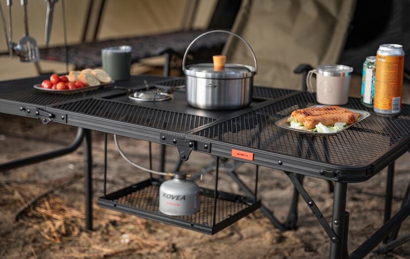 Multi-purpose setup of the KOVEA Mesh IGT 3 Folding Camping Table with compatible camping accessories.