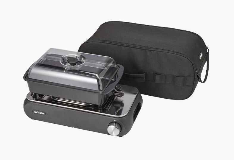 Sleek and durable black portable carry bag packed with all KOVEA Guibada Ceramic components for space-saving storage.