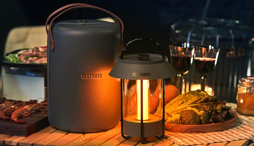 CLAYMORE Selene LED Lantern creating warm ambient lighting at a campsite