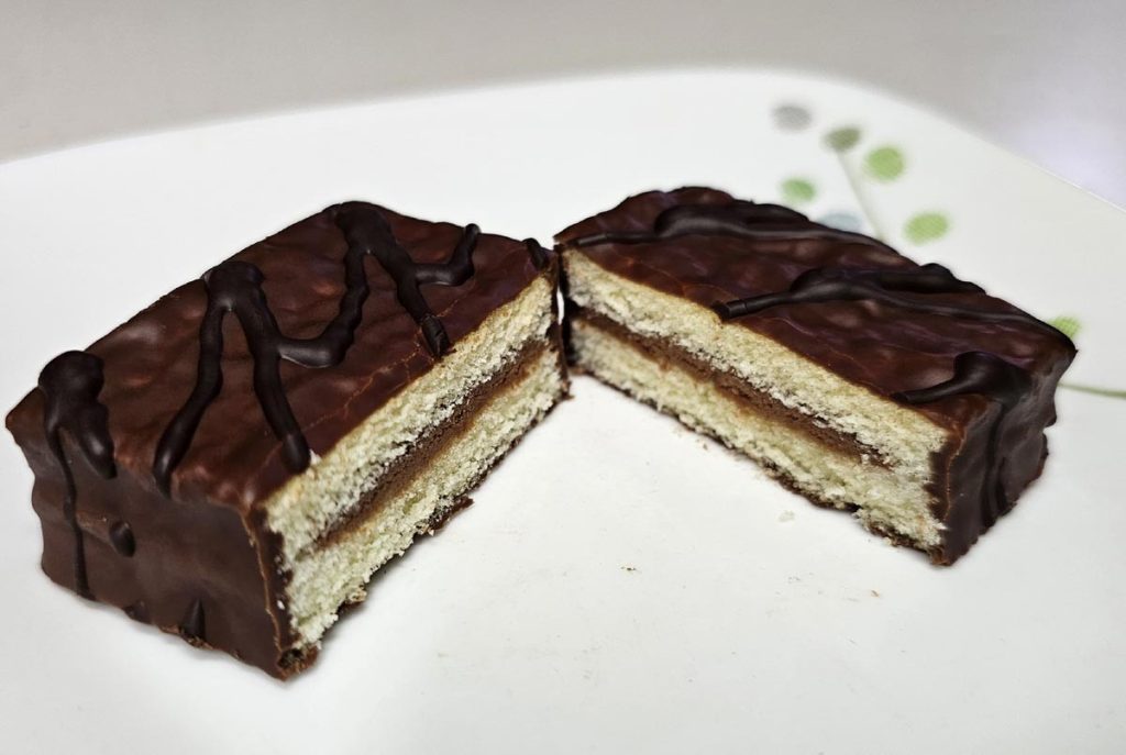 Haitai Oh Yes cut in half showing two soft cake layers and chocolate cream filling