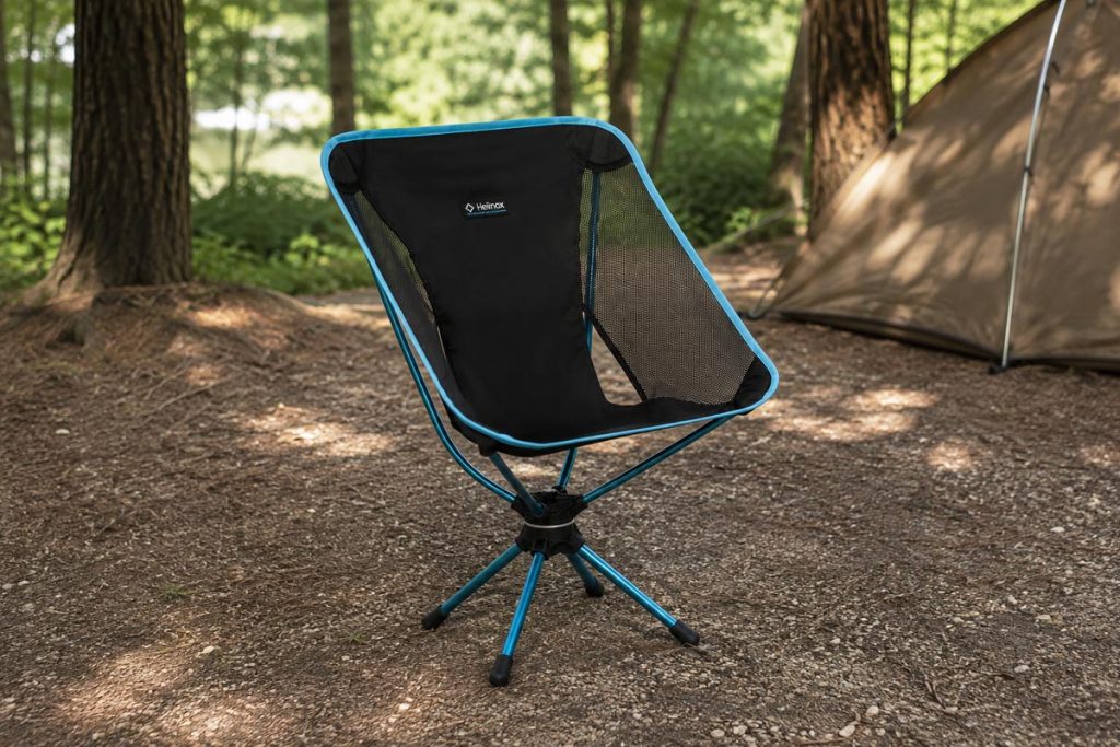 Helinox Swivel Chair set up on the ground at a campsite