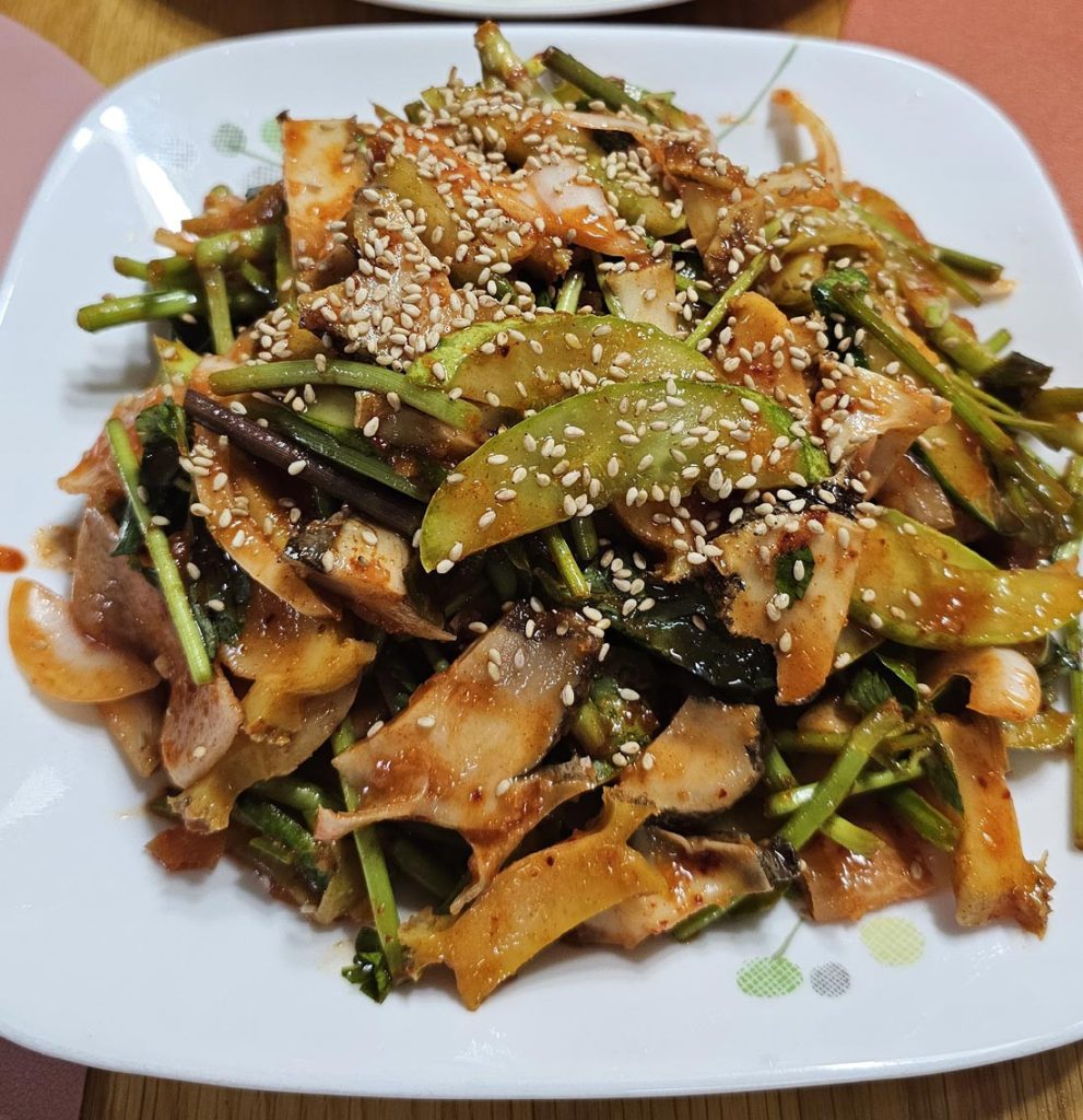 Homemade Korean dish seasoned with gochujang and topped with sesame seeds