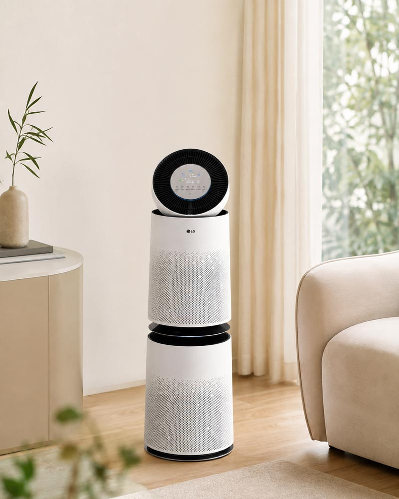 LG PuriCare 360 AS305DWWA air purifier in a modern living room interior for the LG PuriCare 360 vs Coway Noble Air Purifier comparison