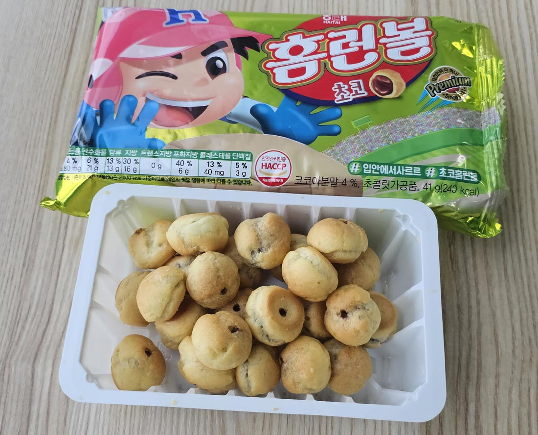 Opened tray of Haitai Homerun Ball chocolate snacks displayed with the outer package